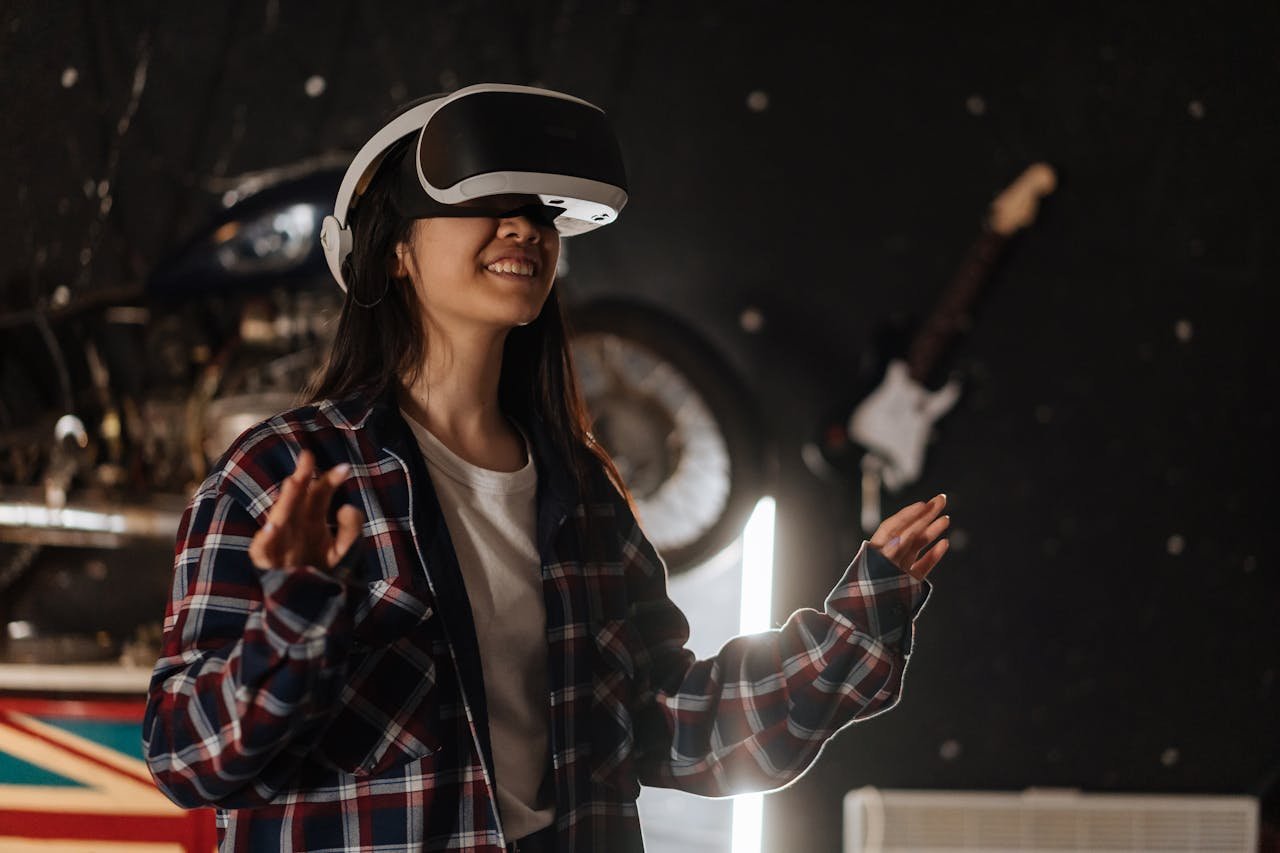 Young woman immersed in virtual reality using a VR headset, enjoying a digital world indoors.
