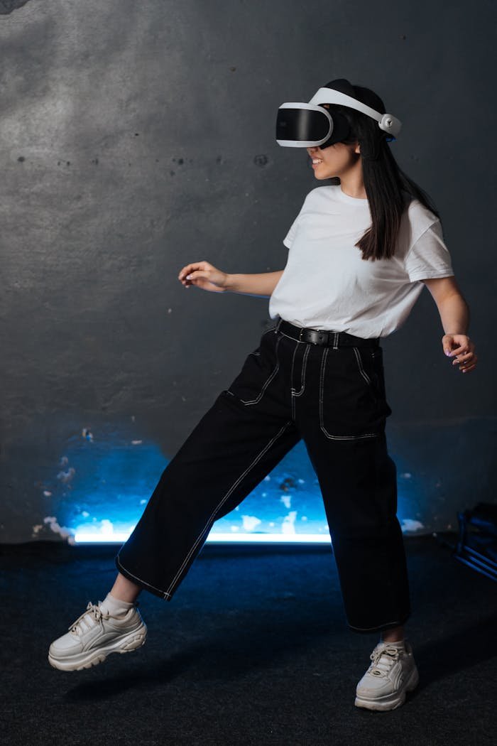 A young woman wearing VR goggles immersed in a virtual reality experience indoors.