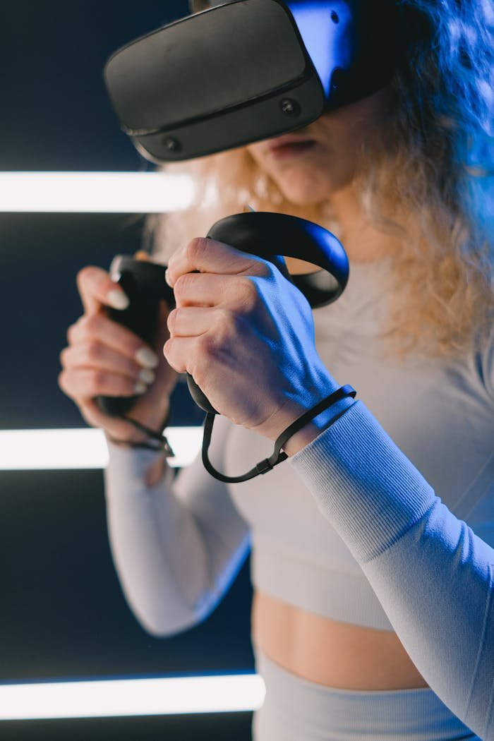 A woman using a virtual reality headset and controllers for an immersive gaming experience.